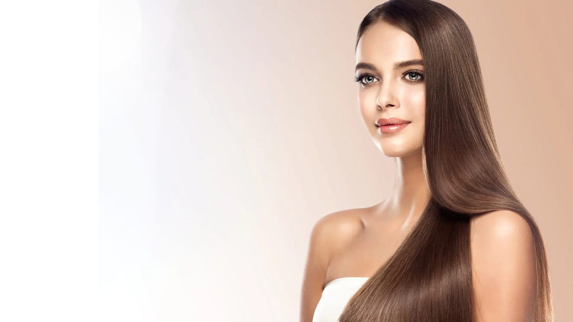 A woman with long hair is posing for the camera.